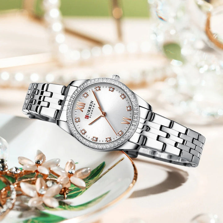 Women's Rhinestone Accented Quartz Watch with Sword-Shaped Pointer